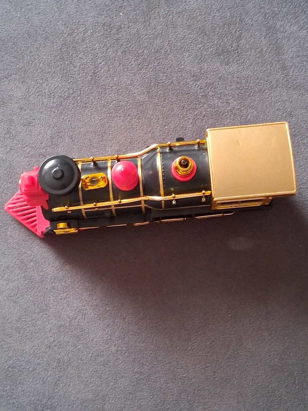 Vintage Style Black and Gold Toy Train with Red Accents